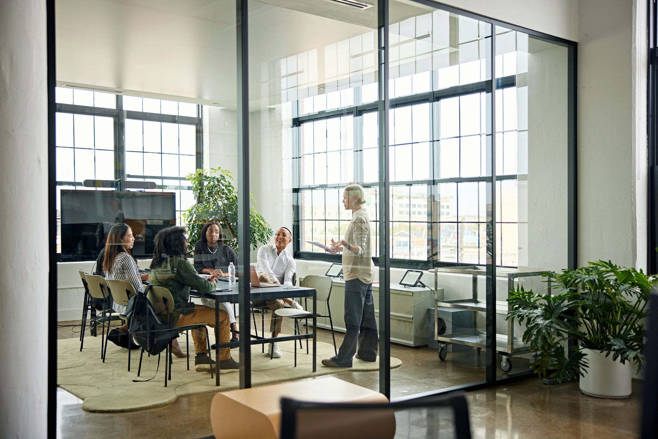 Hamilton Holdings Group team meeting in a modern conference room