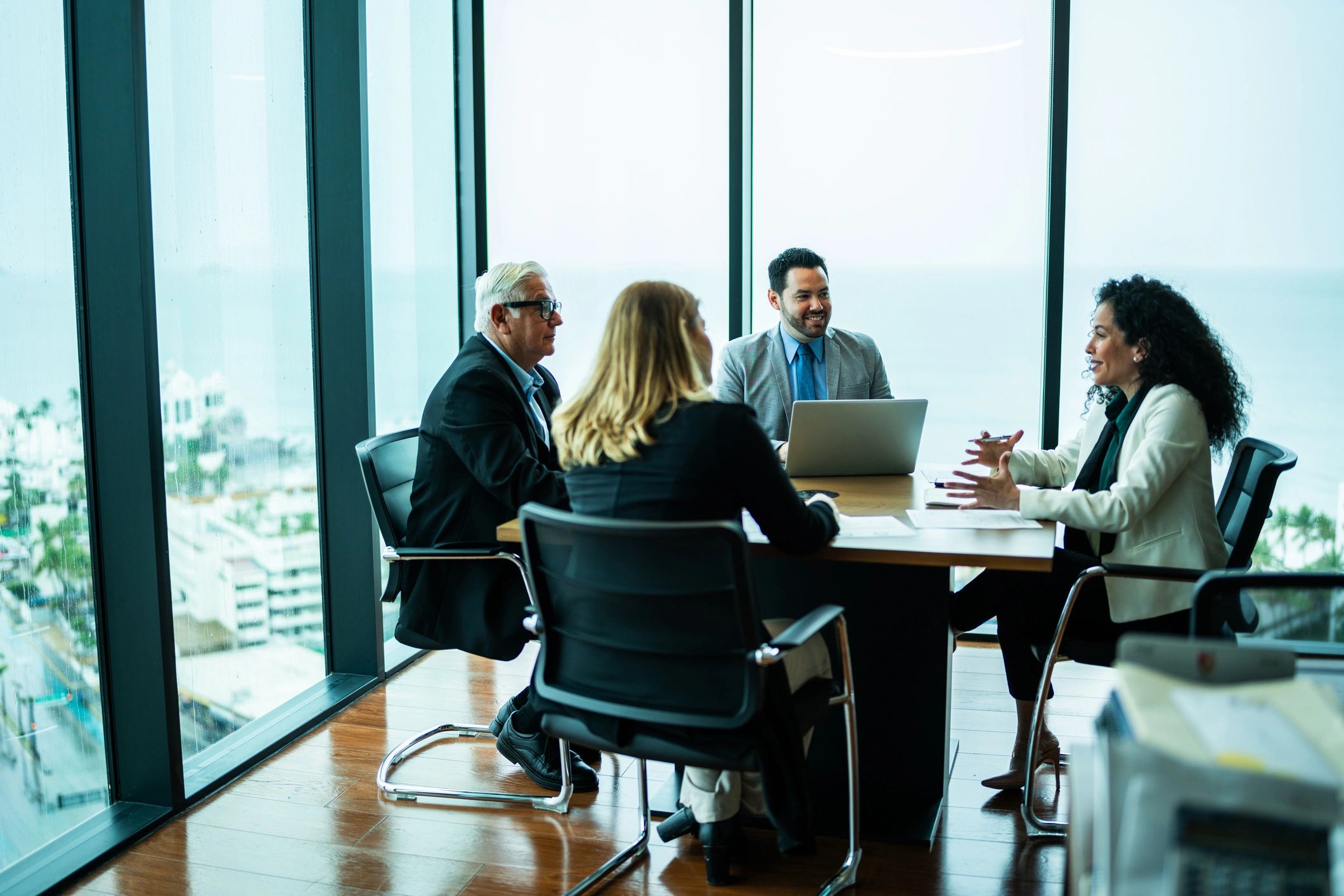 Investment professionals in a boardroom meeting