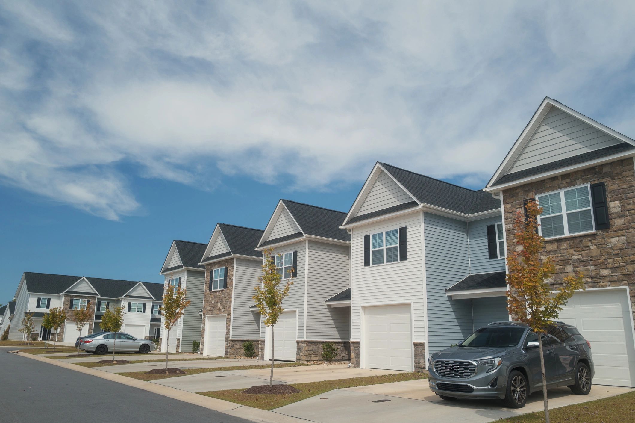 Multifamily townhomes representing residential community investments